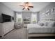 Bright and spacious bedroom with neutral paint, white trim, large windows, and a ceiling fan at 424 Bahama Grande Blvd, Apollo Beach, FL 33572
