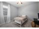Bedroom featuring a single bed, carpet, and neutral walls creating a cozy and peaceful space at 424 Bahama Grande Blvd, Apollo Beach, FL 33572