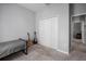 Neutral bedroom with gray carpet, twin bed and closet near open doorway at 424 Bahama Grande Blvd, Apollo Beach, FL 33572