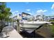 Boat on a lift, perfect for waterfront living, with easy access to the open water and views of the community at 424 Bahama Grande Blvd, Apollo Beach, FL 33572