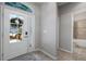 Welcoming foyer featuring a decorative front door with glass panes and a tiled floor that leads into the home at 424 Bahama Grande Blvd, Apollo Beach, FL 33572