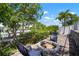 Outdoor fire pit area with comfortable seating, perfect for cozy evenings by the water, surrounded by lush landscaping at 424 Bahama Grande Blvd, Apollo Beach, FL 33572