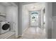 Entrance featuring tiled flooring and adjacent laundry and bedroom access at 424 Bahama Grande Blvd, Apollo Beach, FL 33572