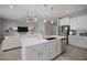 Open-concept kitchen with island and living area, ideal for entertaining and modern living at 424 Bahama Grande Blvd, Apollo Beach, FL 33572