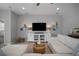Relaxing living room with a TV, decorative lamps, and a view of the entryway at 424 Bahama Grande Blvd, Apollo Beach, FL 33572