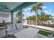 Cozy screened patio featuring comfortable seating and serene views of the yard at 424 Bahama Grande Blvd, Apollo Beach, FL 33572