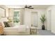 Serene bedroom with soft lighting, a cushioned bench, decorative mirror, and a large window at 4807 Southern Valley Loop, Brooksville, FL 34601