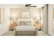 Inviting bedroom with cozy bedding, a bench, a large window, and warm, neutral tones at 4807 Southern Valley Loop, Brooksville, FL 34601