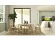 Bright dining area featuring a modern table, stylish chairs, and natural light at 4807 Southern Valley Loop, Brooksville, FL 34601