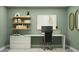 Stylish home office featuring a minimalist design with ample desk space and shelving at 4807 Southern Valley Loop, Brooksville, FL 34601