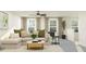 Comfortable living room featuring natural lighting, stylish decor, neutral tones, and ample seating at 4807 Southern Valley Loop, Brooksville, FL 34601
