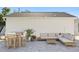 Cozy backyard with a paved patio, stylish outdoor furniture, string lights, and landscaping at 5298 Oxford N Ave, St Petersburg, FL 33710