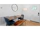 Bright dining area with hardwood floors and modern light fixture at 5298 Oxford N Ave, St Petersburg, FL 33710