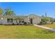 Charming single-story home with lush lawn, landscaped yard, and inviting pathway at 5298 Oxford N Ave, St Petersburg, FL 33710