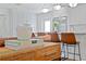 Modern kitchen featuring white cabinets, stainless steel appliances, and a large island at 5298 Oxford N Ave, St Petersburg, FL 33710