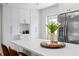 Modern kitchen featuring a white island, stainless steel appliances and integrated pantry space at 5298 Oxford N Ave, St Petersburg, FL 33710