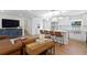 Open-concept living space featuring a modern kitchen with a large island and stylish seating at 5298 Oxford N Ave, St Petersburg, FL 33710