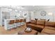 Bright living space with an open-concept design, seamlessly blending the kitchen and seating area at 5298 Oxford N Ave, St Petersburg, FL 33710