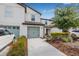 Exterior view of a modern two-story townhome showcasing the architecture, landscaping, and curb appeal at 5429 Companion Ln, Tampa, FL 33619