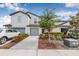 Exterior view of a modern two-story townhome showcasing the architecture, landscaping, and curb appeal at 5429 Companion Ln, Tampa, FL 33619