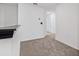 Upstairs hallway featuring neutral carpet and access to rooms at 5429 Companion Ln, Tampa, FL 33619