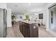 Open concept kitchen with a central island and sight lines to living and dining areas at 5429 Companion Ln, Tampa, FL 33619