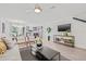 Bright, open living space with hardwood floors and an open layout leading to the dining area and kitchen at 5429 Companion Ln, Tampa, FL 33619
