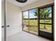 Enclosed patio features large window with natural light and backyard pasture views at 5429 Companion Ln, Tampa, FL 33619