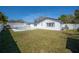The backyard features a pool and grass at 6765 Ralston Beach Cir, Tampa, FL 33614
