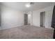 Spacious bedroom with plush carpet, closet and access to the hall at 6765 Ralston Beach Cir, Tampa, FL 33614