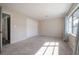 Neutral-toned bedroom featuring plush carpet, a large closet, and natural light at 6765 Ralston Beach Cir, Tampa, FL 33614