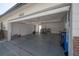 Attached two car garage with concrete floor, laundry area with washer and dryer at 6765 Ralston Beach Cir, Tampa, FL 33614