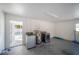 Laundry room featuring side-by-side washer and dryer, water heater, and access to the pool at 6765 Ralston Beach Cir, Tampa, FL 33614