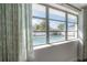 View from a bedroom window overlooking a fenced-in pool area at 6765 Ralston Beach Cir, Tampa, FL 33614
