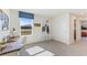 This bedroom offers a comfortable workspace, perfect for study or remote work, with ample natural light and neutral decor at 6915 Broad River Ave, Land O Lakes, FL 34638