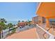 Balcony view showcasing the pool, palm trees, and ocean at 7430 Sunshine Skyway S Ln # 403, St Petersburg, FL 33711
