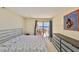 The main bedroom has a walkout patio and dresser storage at 7430 Sunshine Skyway S Ln # 403, St Petersburg, FL 33711