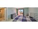 Cozy bedroom with access to a private balcony and natural light at 7430 Sunshine Skyway S Ln # 403, St Petersburg, FL 33711