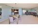 Open-concept living area connects to the dining space and flows into the kitchen at 7430 Sunshine Skyway S Ln # 403, St Petersburg, FL 33711