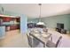 The condo features an open living area that leads into the kitchen and dining space at 7430 Sunshine Skyway S Ln # 403, St Petersburg, FL 33711