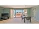 Inviting living room and dining area with great natural light and direct access to the balcony at 7430 Sunshine Skyway S Ln # 403, St Petersburg, FL 33711