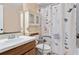 Functional bathroom featuring a vanity and a floral shower curtain at 747 Stillview Cir, Brandon, FL 33510