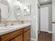 Bright bathroom with a double vanity, modern fixtures, and a walk-in closet at 747 Stillview Cir, Brandon, FL 33510
