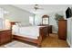 Comfortable bedroom features classic wood furniture and a ceiling fan at 747 Stillview Cir, Brandon, FL 33510