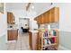 Bright kitchen features wooden cabinets, blue tile backsplash, and an island for extra counter space at 747 Stillview Cir, Brandon, FL 33510