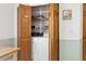 Convenient laundry area with bi fold wooden doors and shelving at 747 Stillview Cir, Brandon, FL 33510