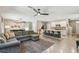 Spacious living room with an open floor plan, seamlessly connecting the kitchen, dining, and lounging areas at 7591 Cypress Walk Dr, New Port Richey, FL 34655