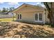 Large backyard with mature trees and ample space for outdoor activities or recreation at 8721 N Whittier St, Tampa, FL 33617