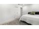 Bright bedroom features a comfortable bed, a decorative rug, and fresh white paint at 8721 N Whittier St, Tampa, FL 33617