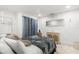 Cozy bedroom featuring modern decor and natural light from the window with privacy curtains at 8721 N Whittier St, Tampa, FL 33617